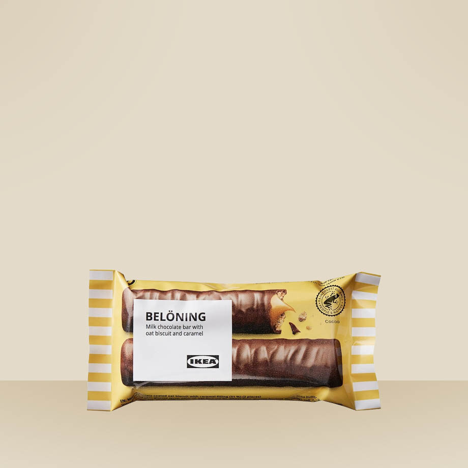 Balenie BELÖNING mliečnej čokolády s ovosom a karamelom s certifikátom Rainforest Alliance.